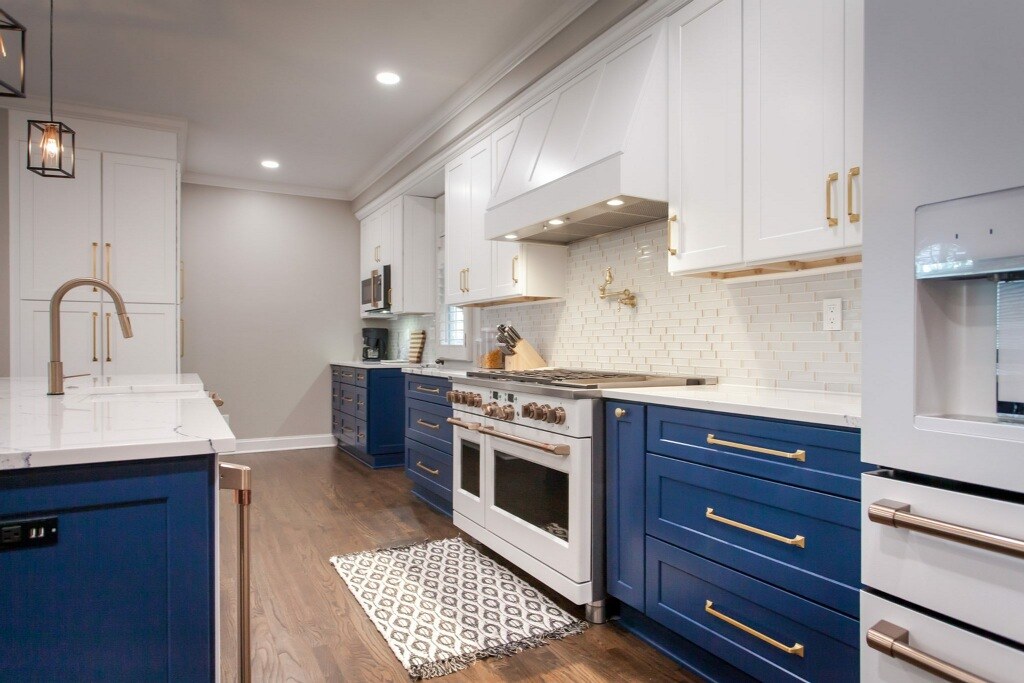 Navy base cabinets with white uppers in North Atlanta GA — AAA Construction Services