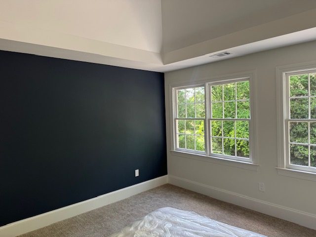 Navy accent wall, bedroom in Buckhead GA — AAA Construction Services