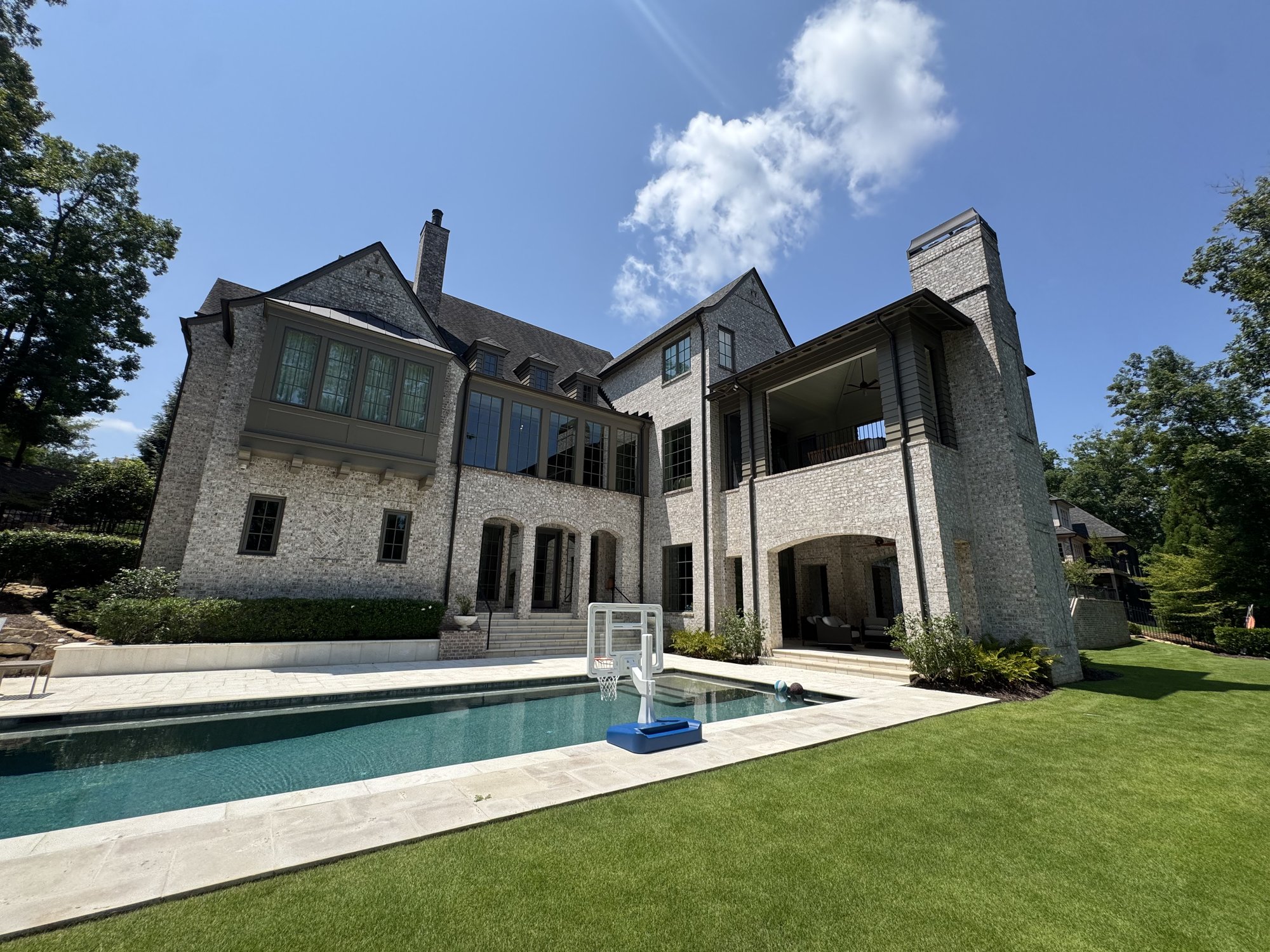 Exterior trim & siding repaint — rear elevation and pool in Cumming GA — AAA Construction Services