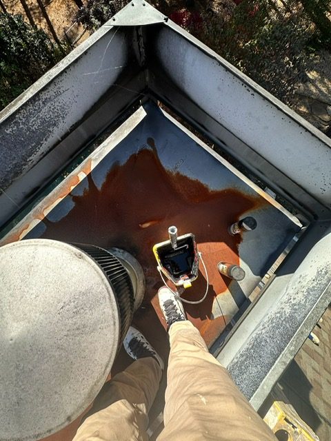 Chimney cap rust-prevention paint in Roswell GA — AAA Construction Services