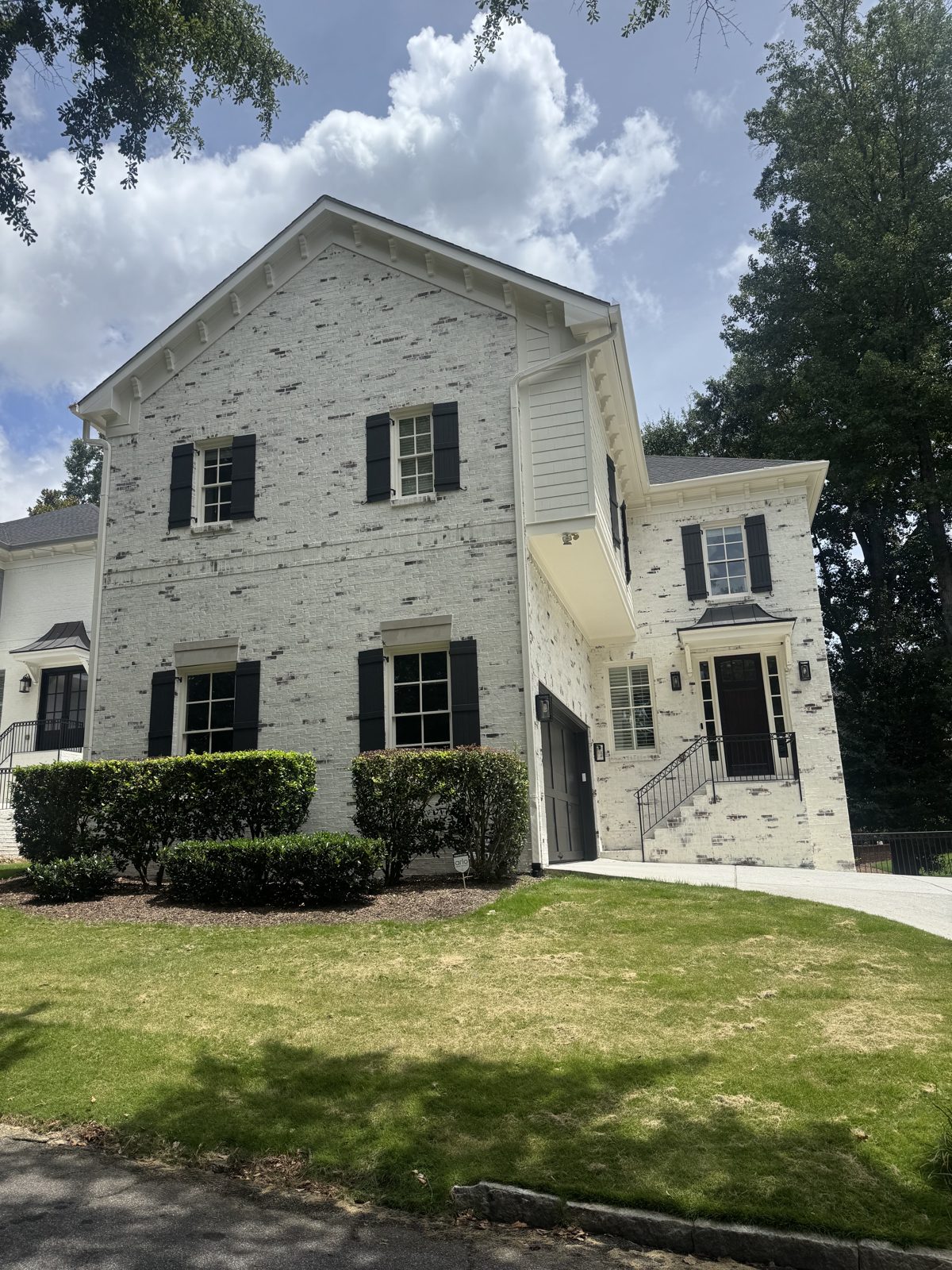 Limewash white brick home in Milton GA — AAA Construction Services