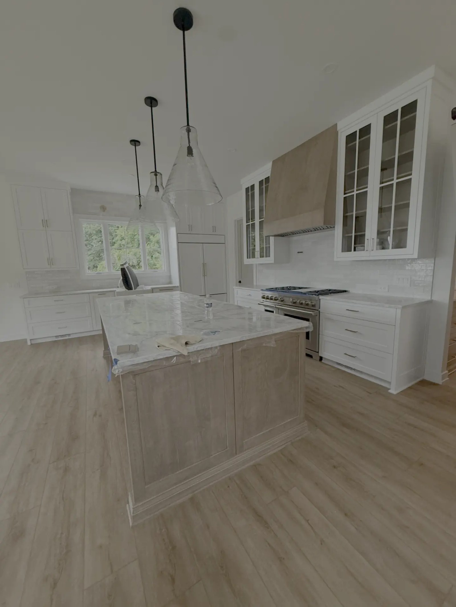 Finished kitchen — white cabinetry, marble island in Milton GA — AAA Construction Services